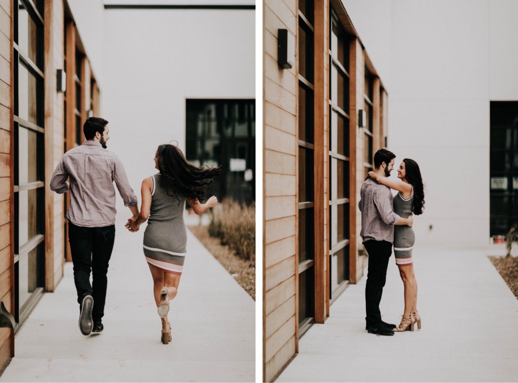 couple running with each other outside apartment during their at-home engagement