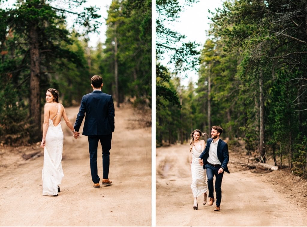 couple running down a dirt road during their camper van elopement wedding in the Colorado Rocky Mountains