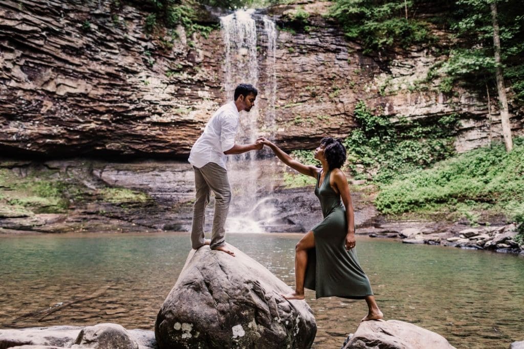 engaged couple slow dancing during their waterfall engagement photos