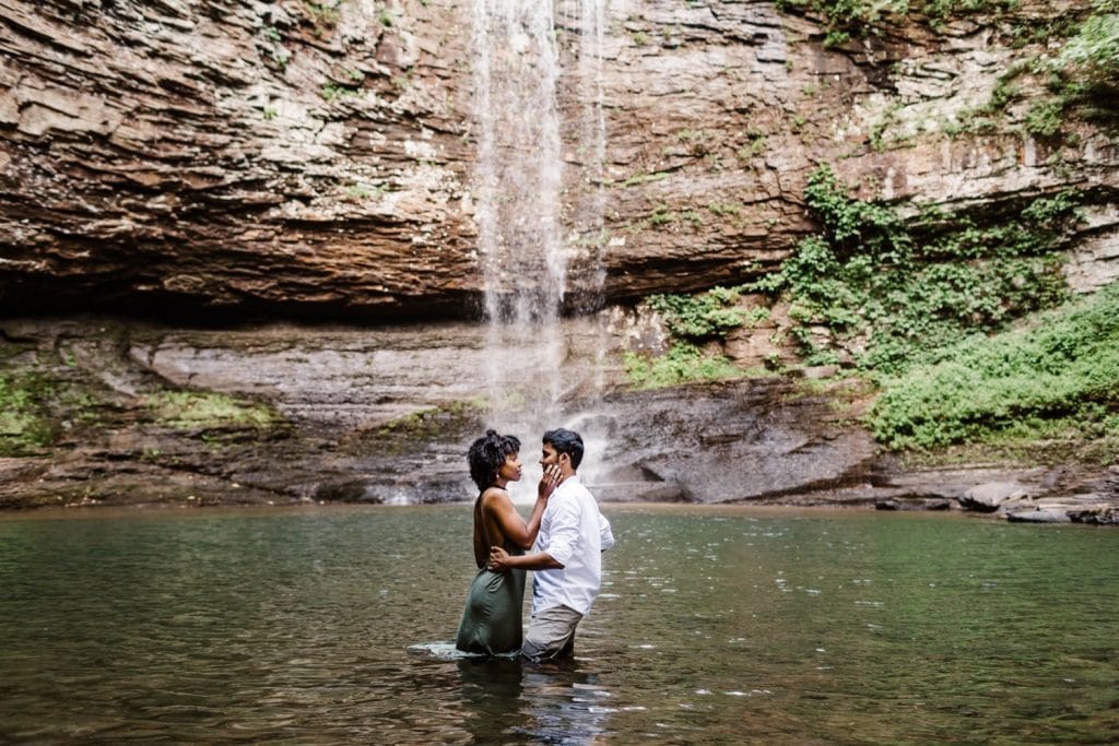 engaged couple slow dancing during their waterfall engagement session
