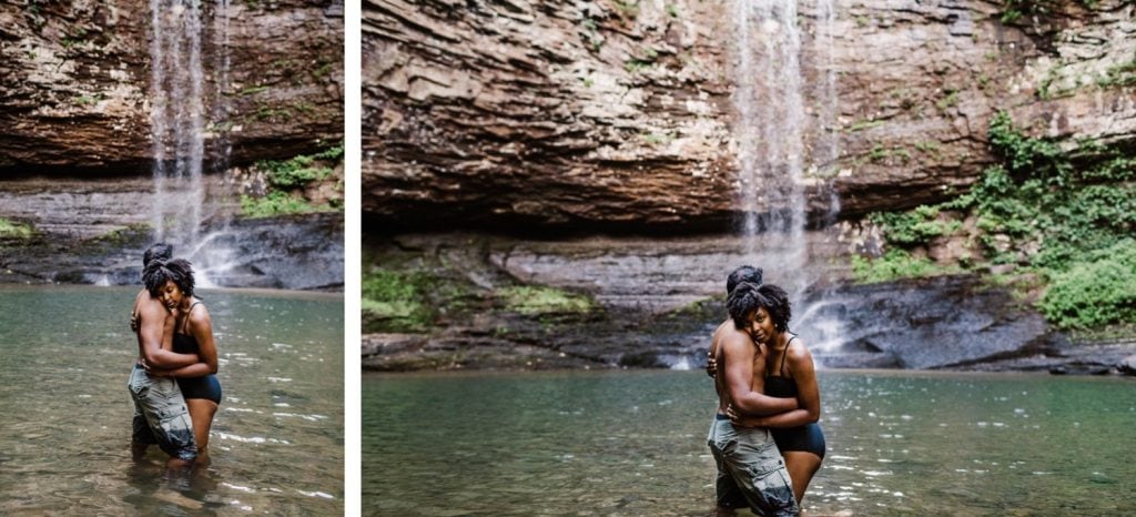 engaged couple playing in waterfall during their waterfall engagement photos