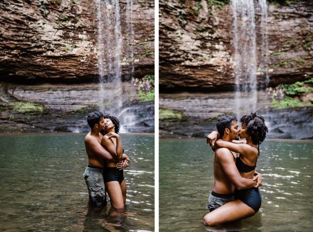 engaged couple playing in the water during their waterfall engagement photos