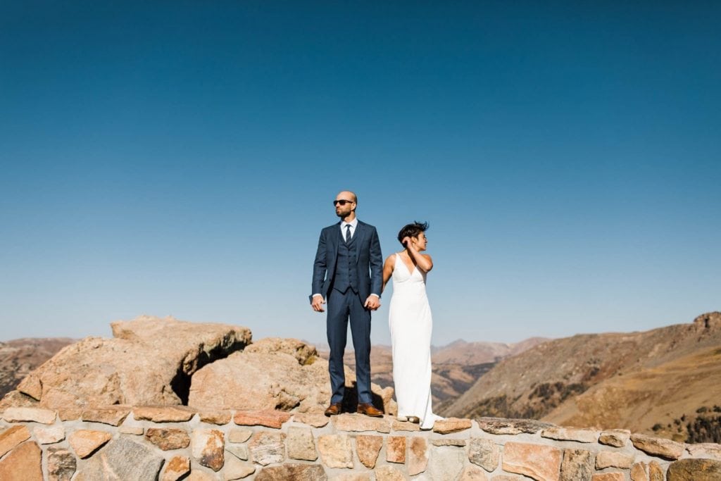 couple standing on the edge of the Rocky Mountains | Estes Park elopement photographers