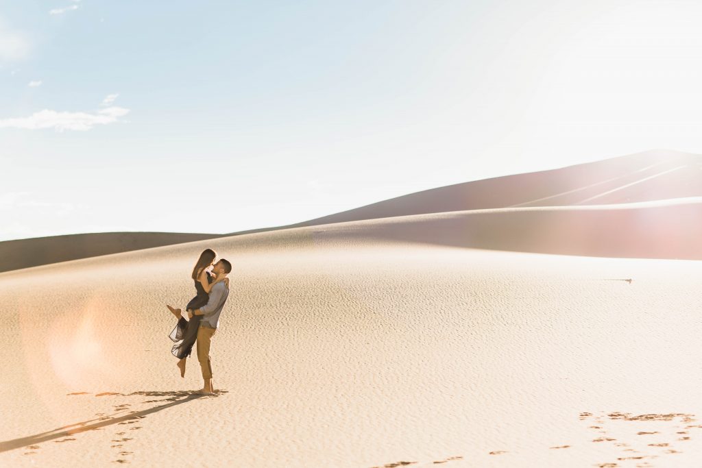 boho engagement outfit inspiration for a sand dunes engagement session