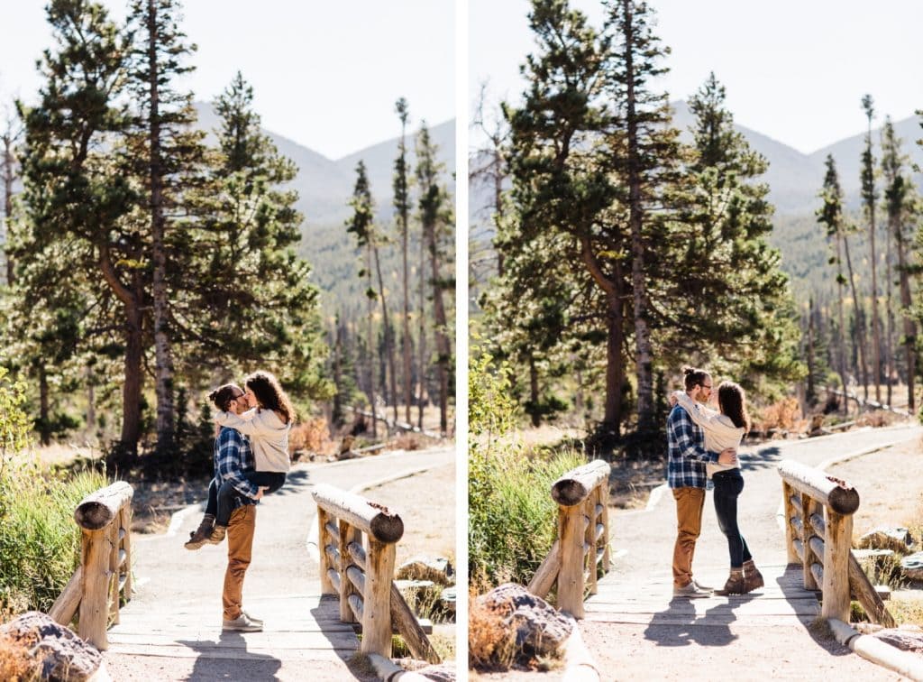 engaged couple kissing by Sprague Lake in Rocky Mountain National Park