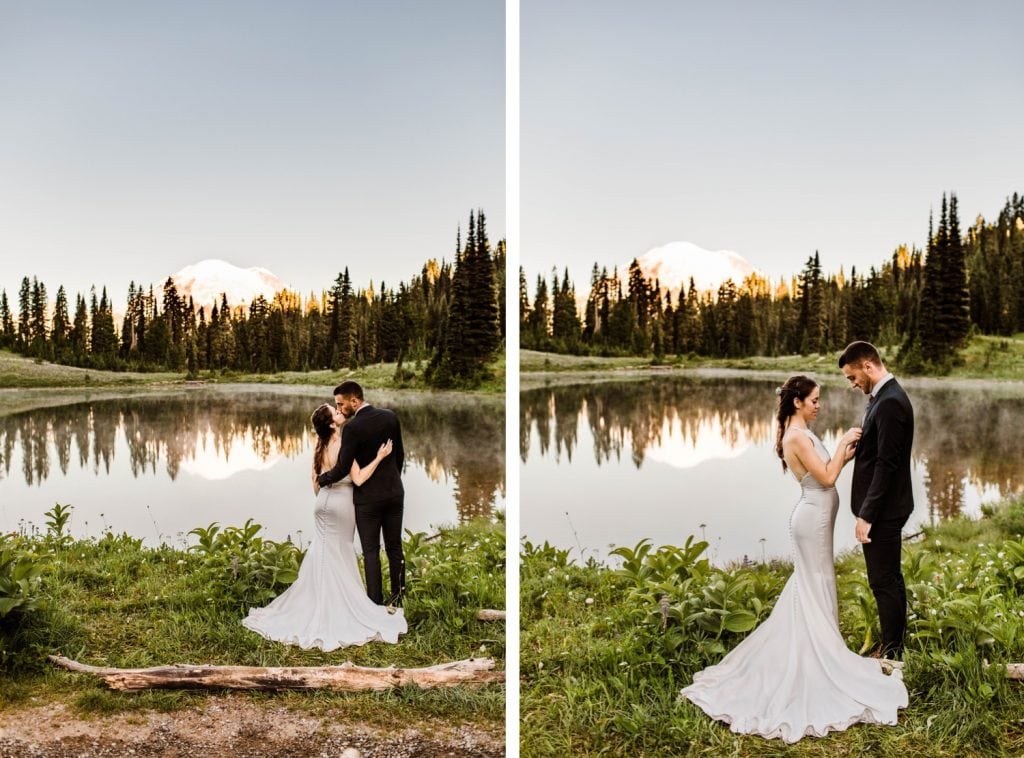 eloping couple standing by an alpine lake during their Mt Rainier elopement | Washington state elopement wedding