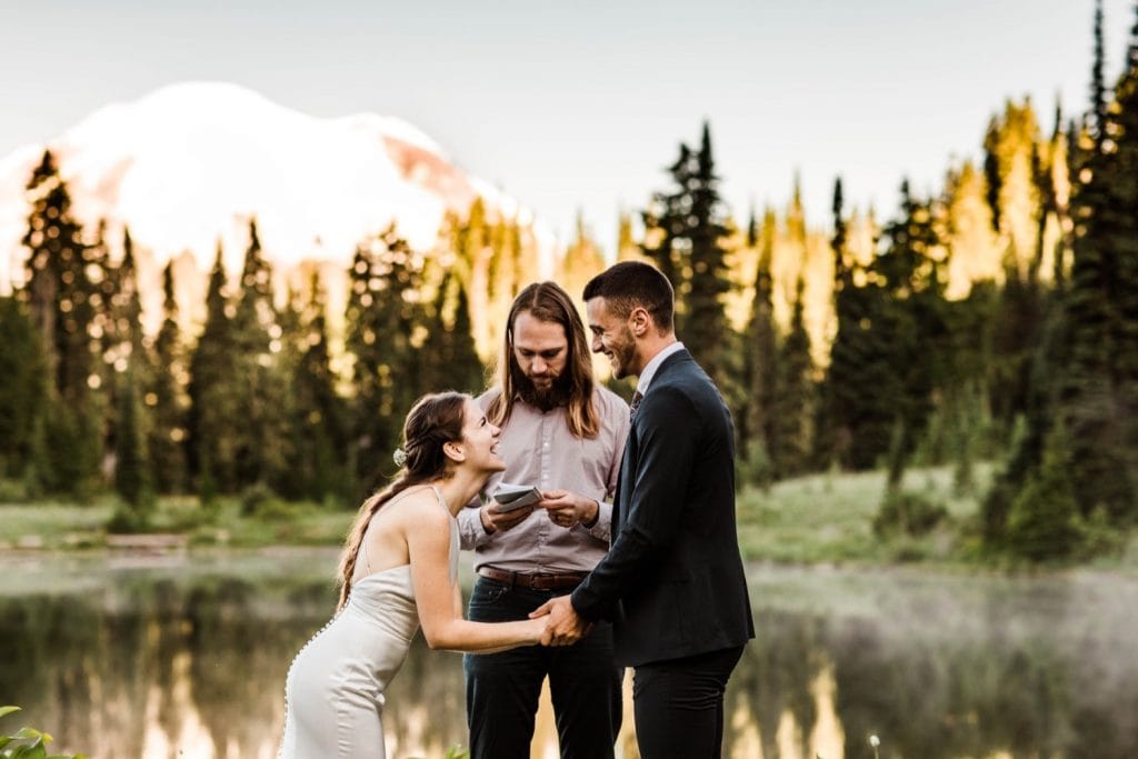 ring exchange during a Mt Rainier elopement ceremony | national park elopement photographers in Washington state