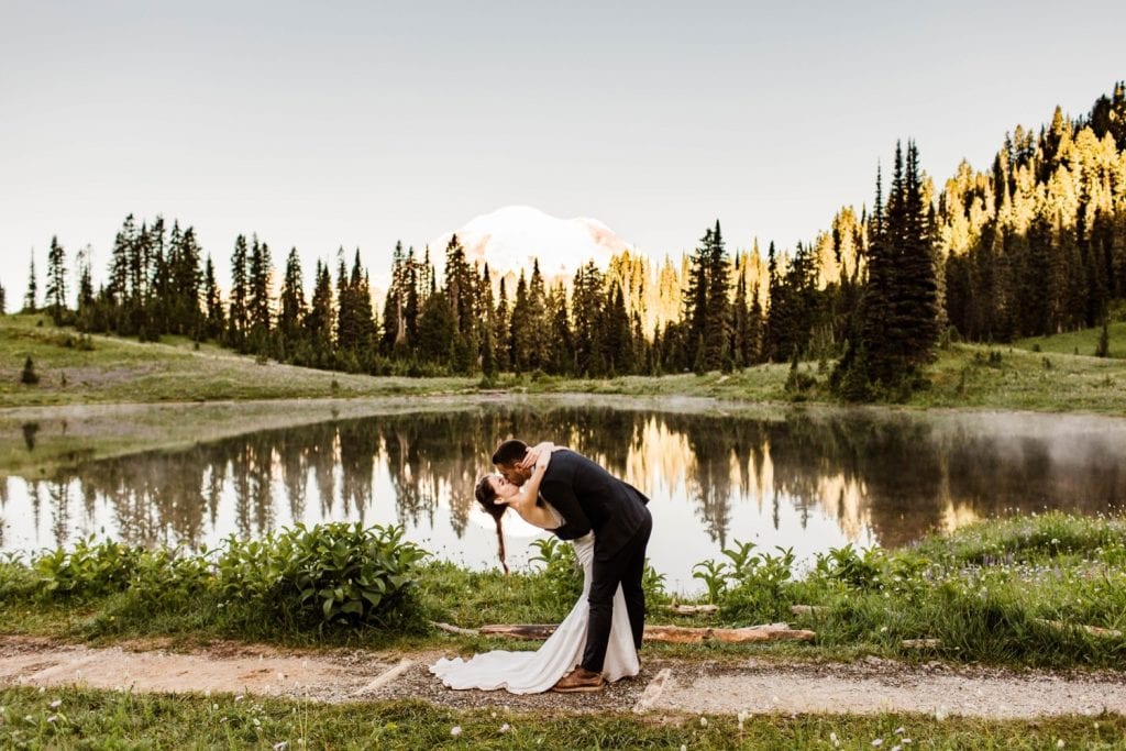 first kiss during mountain elopement ceremony in Mt Rainier | national park elopement photographers in Washington state