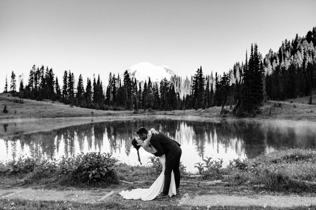 first kiss during mountain elopement ceremony in Mt Rainier | national park elopement photographers in Washington state