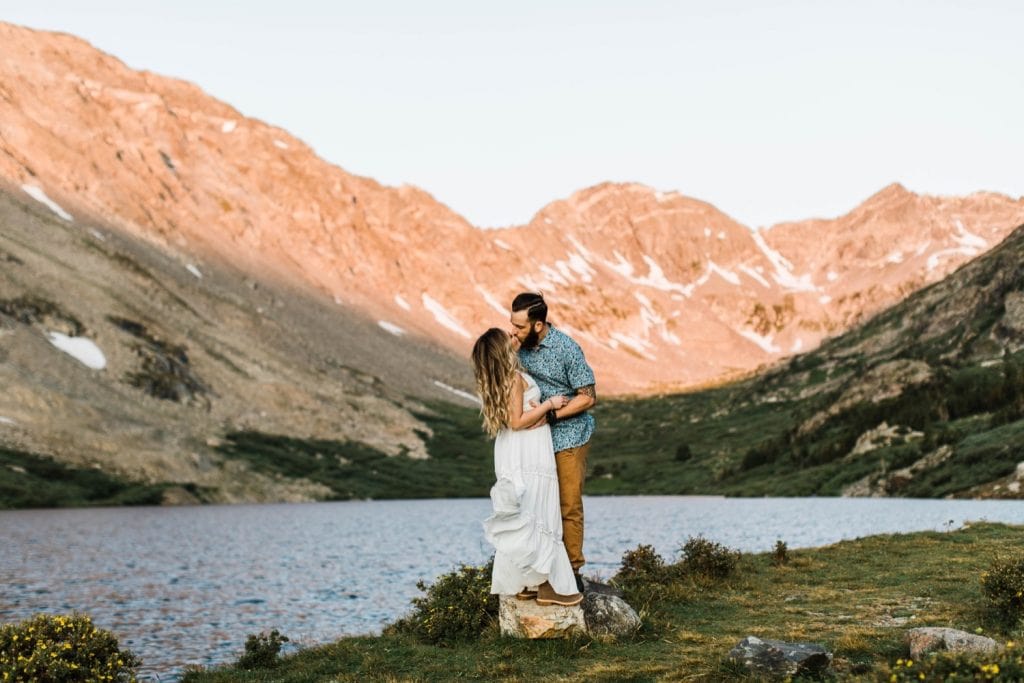 couple kissing in their wedding attire during their Breckenridge adventure session in the Colorado mountains | adventure elopement photographers in Colorado