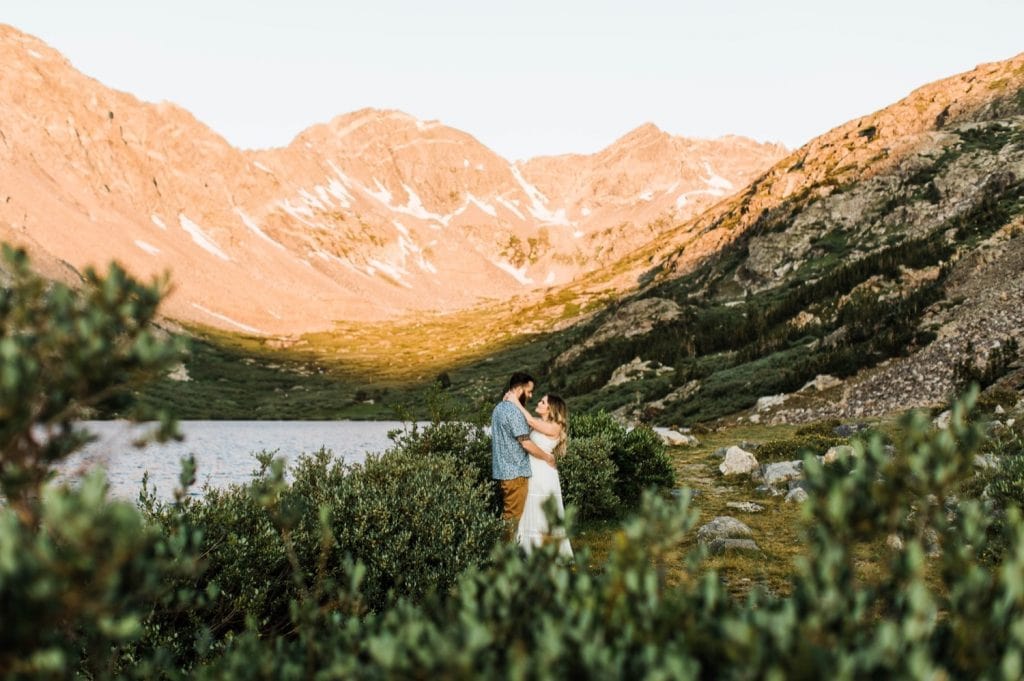 eloping couple slow dancing in the mountains during their adventurous engagement photos in Breckenridge | Colorado elopement and mountain wedding photographers