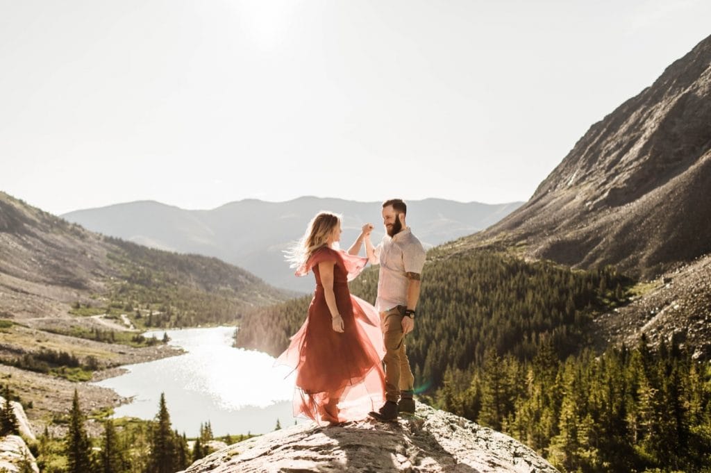 couple planning to elope in Breckenridge dancing at sunrise on top of a mountain | adventurous Breckenridge wedding photographers