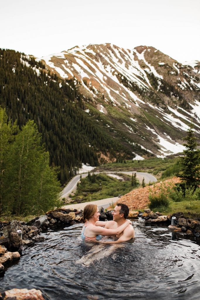 adventurous mountain engagement photos taken at a secret hot spring in Telluride Colorado