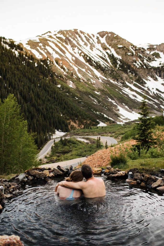 adventurous mountain engagement photos taken at a secret hot spring in Telluride Colorado