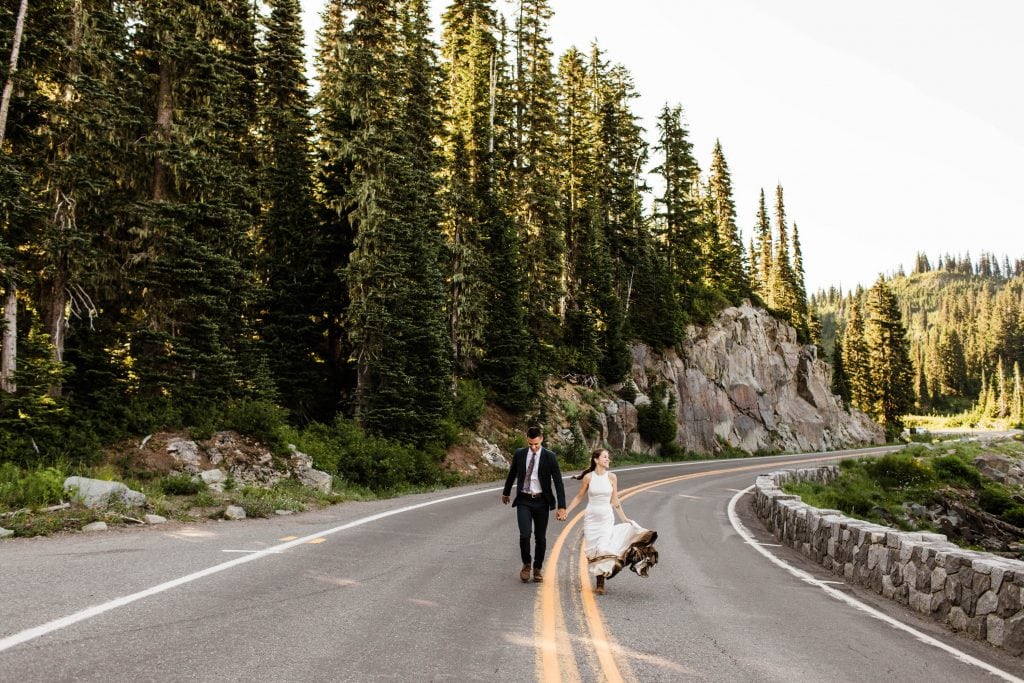 photo of couple running through the mountains of Washington during their elopement