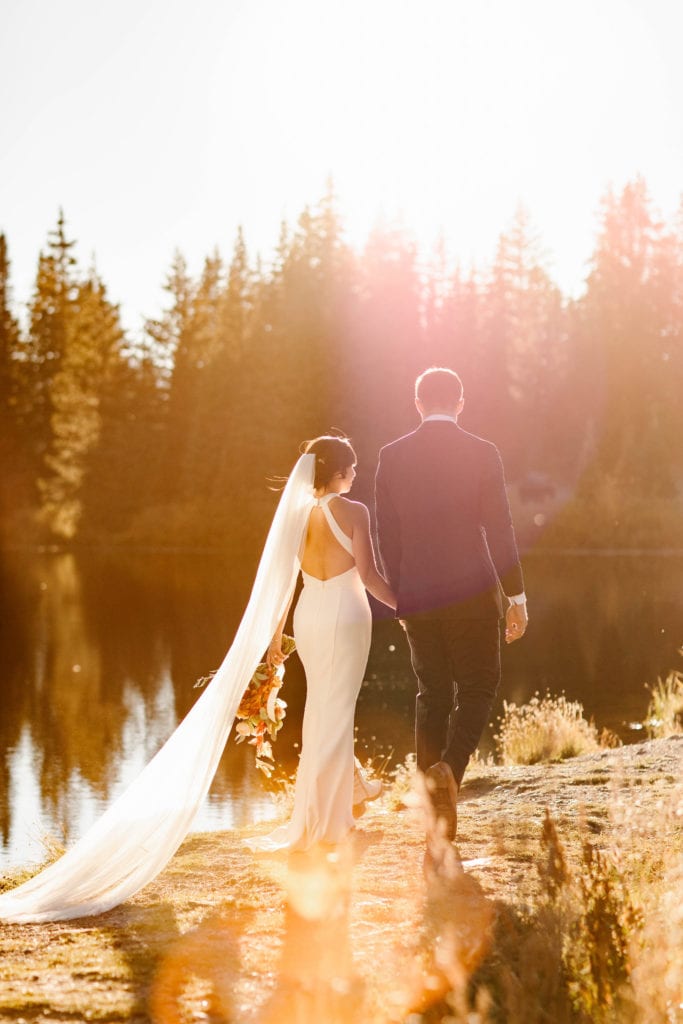eloping couple walking down an outdoors path together - planning elopement checklist