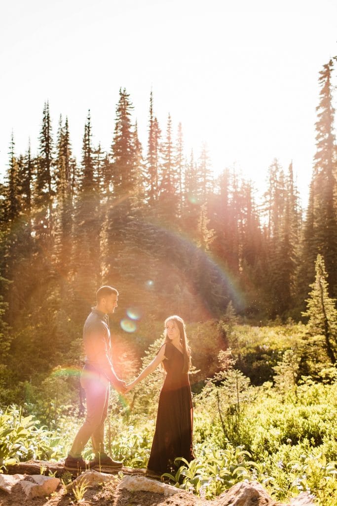 couple wandering through mountains while getting their Seattle engagement photos taken