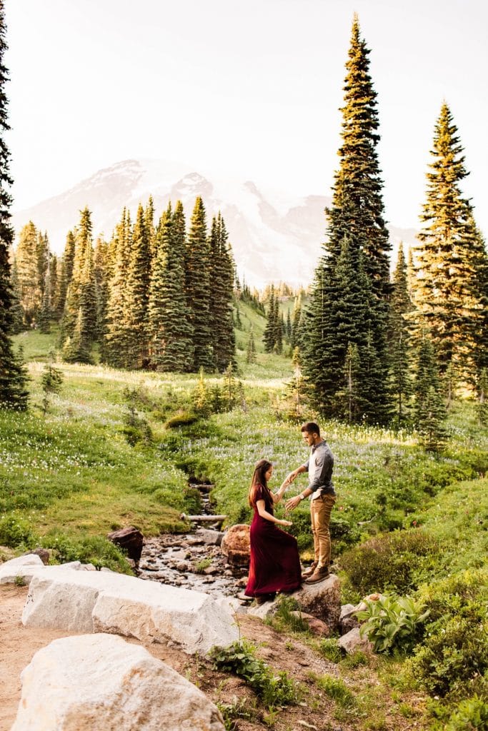 couple wandering through mountains while getting their Seattle engagement photos taken
