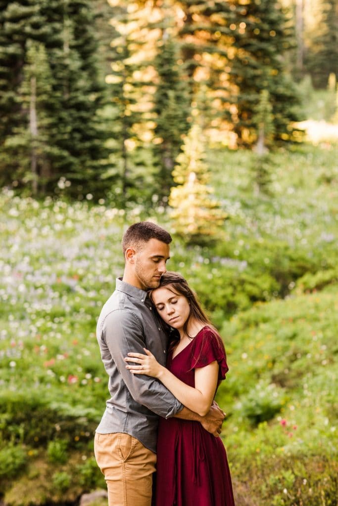 couple admiring the view in the mountains of WA during their Seattle engagement photos