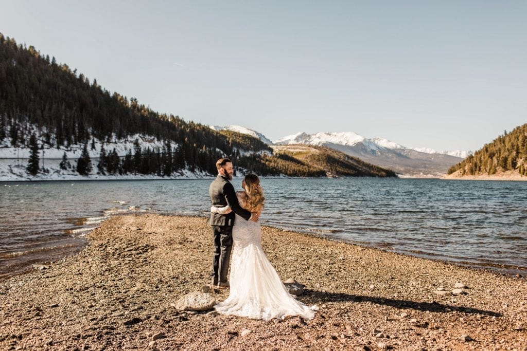 couple admiring the view of Lake Dillon before they getting married at Sapphire Point Overlook
