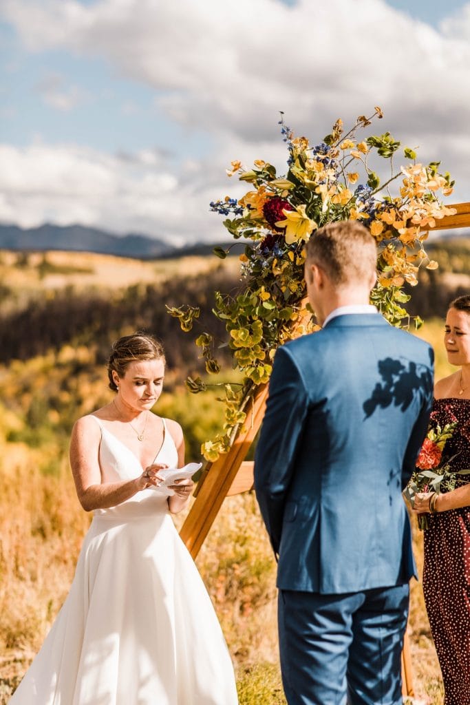vow reading during a mountainous Telluride wedding ceremony at a horse ranch on Wilson Mesa