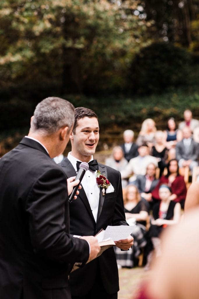 groom reading his vows during his wedding at Dunaway Gardens