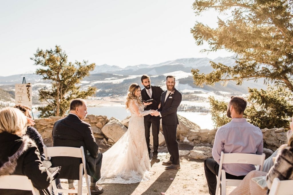 couple standing together and holding hands during their Sapphire Point Overlook wedding ceremony