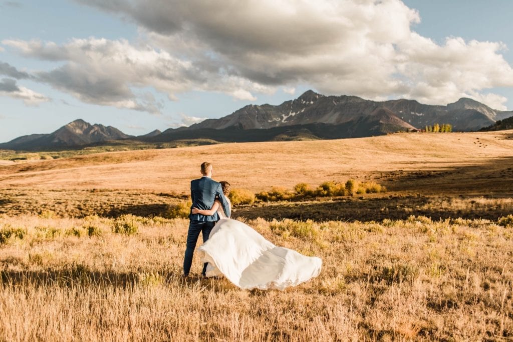 adventurous couples photos taken at sunset during a small Telluride wedding at a ranch on Wilson Mesa | photographed by Telluride Colorado wedding photographers