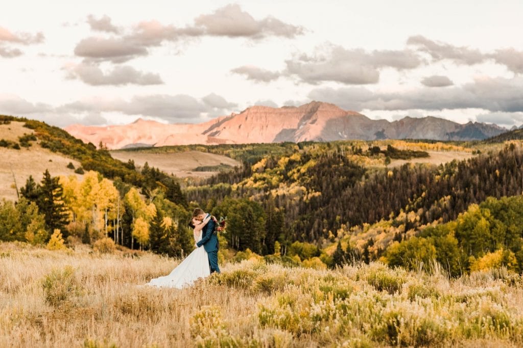 couple kissing at sunset during their Telluride wedding photos | photo taken by Telluride wedding photographers