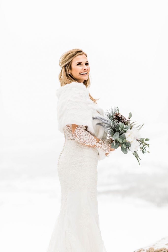 snowy bridal photos in the snow at Sapphire Point Overlook