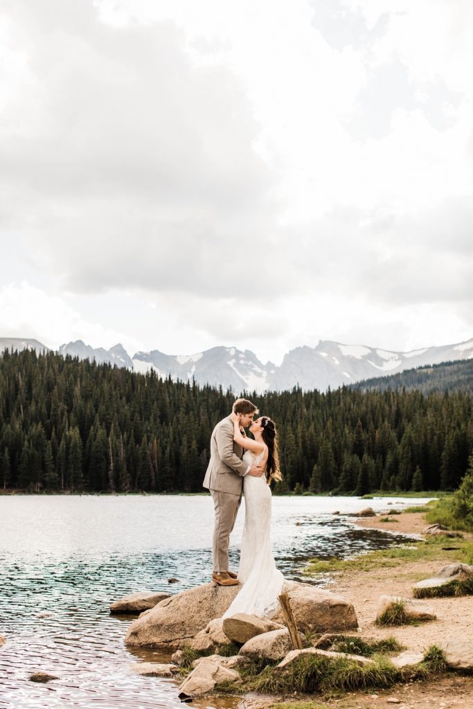 mountain wedding in Colorado Rocky Mountains by an alpine lake after a storm rolled in