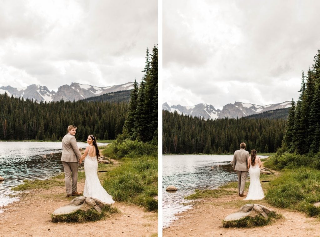 couple hiking around a lake after their mountain wedding in Colorado