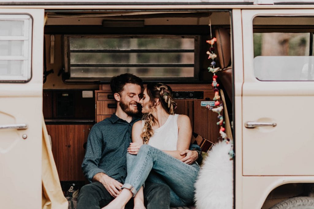 photo of couple kissing in a camper van taken by a Colorado engagement photographer