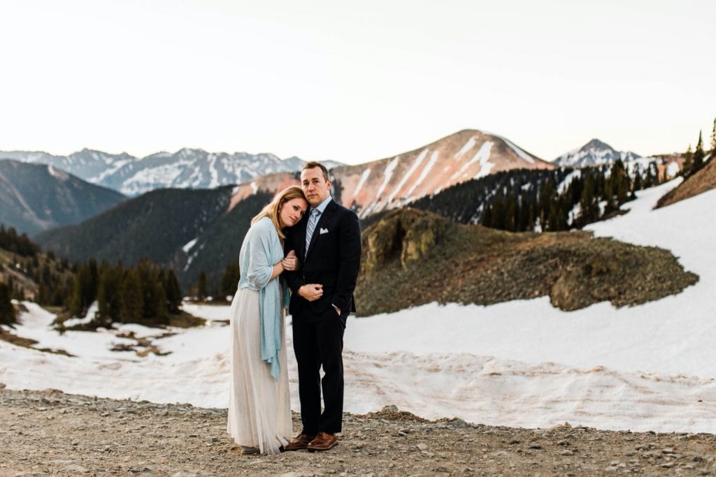 couple enjoying the view of the mountains during a Telluride elopement at sunrise