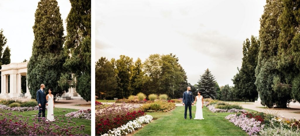 couple walking through a garden before their Denver Botanic Gardens wedding