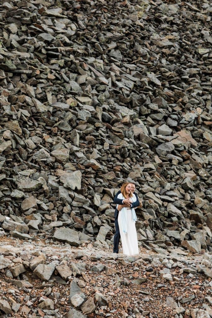 eloping couple hiking down a trail during their Telluride elopement