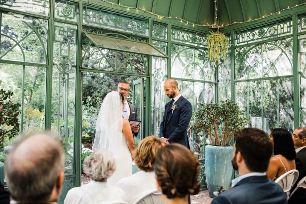 small Denver Botanic Gardens wedding ceremony in a greenhouse