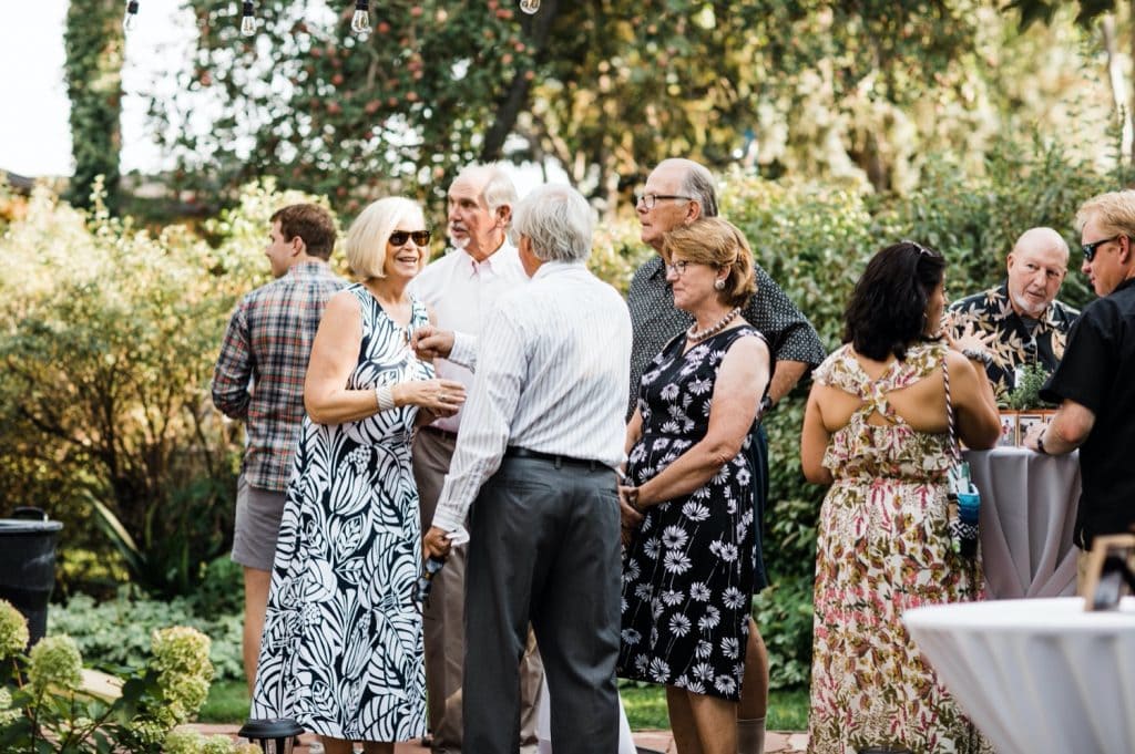 people mingling at cocktail hour after a Denver Botanic Gardens wedding