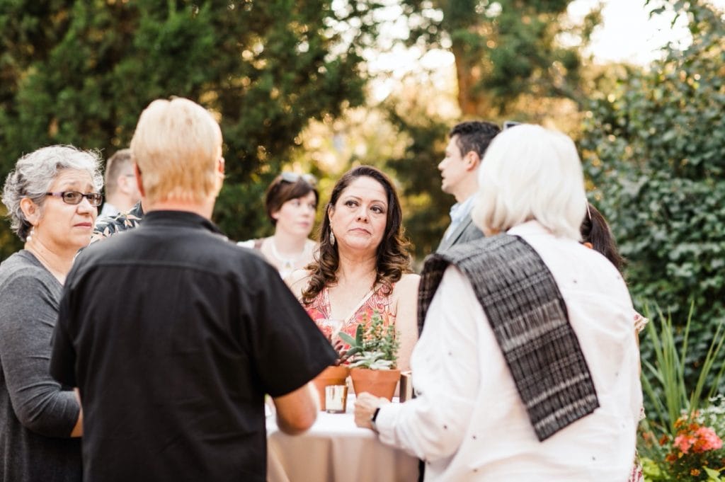 people mingling at cocktail hour after a Denver Botanic Gardens wedding