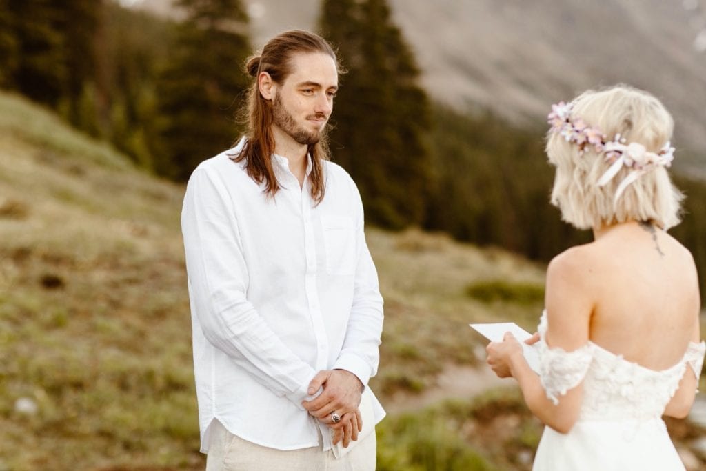 vow reading during a tiny lake wedding Ceremony