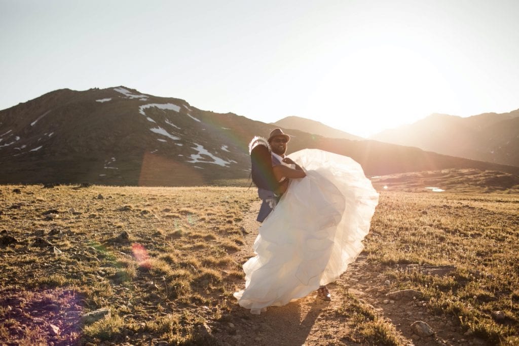 couple hiking through the mountains for their Aspen Colorado elopement