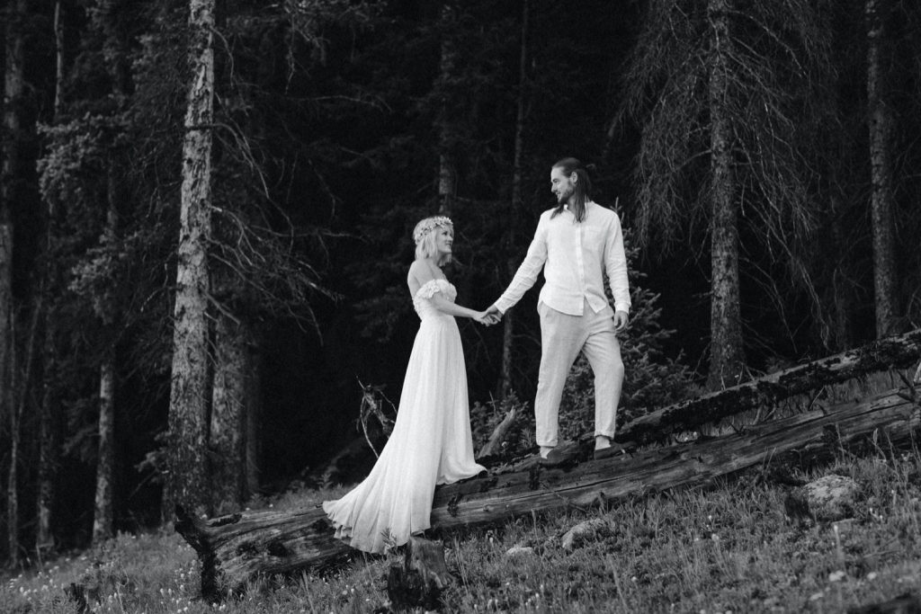 eloping couple in the woods after their small lake wedding in Colorado