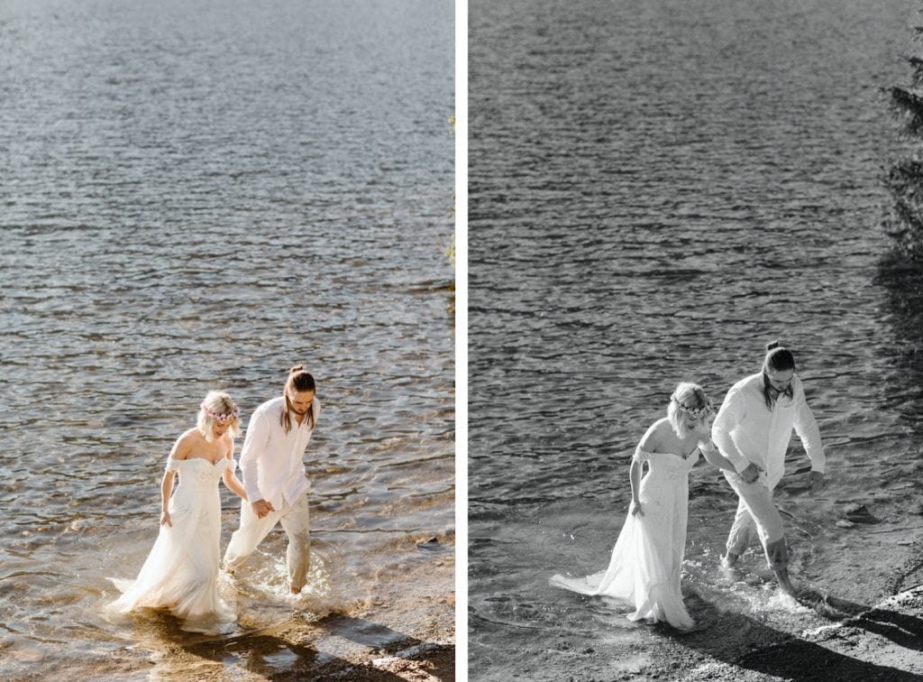 couple wading into the water after their lake wedding ceremony