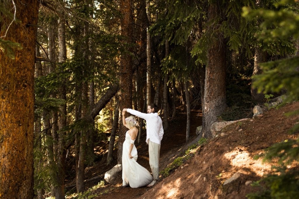 eloping couple dancing in the forest