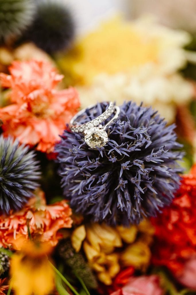 diamond ring sitting on elopement bouquet for a Snowy Range Wyoming elopement