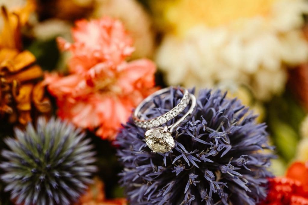 diamond ring sitting on elopement bouquet for a Snowy Range Wyoming elopement