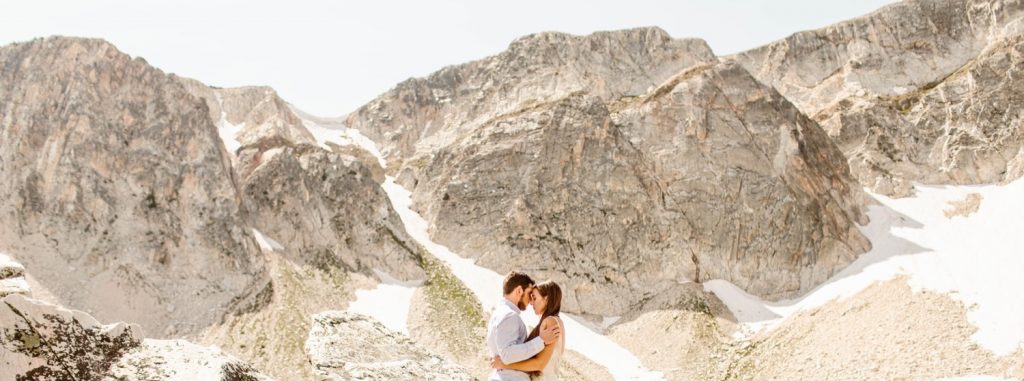 bride and groom adventuring in the mountains after their Snowy Range Wyoming elopement