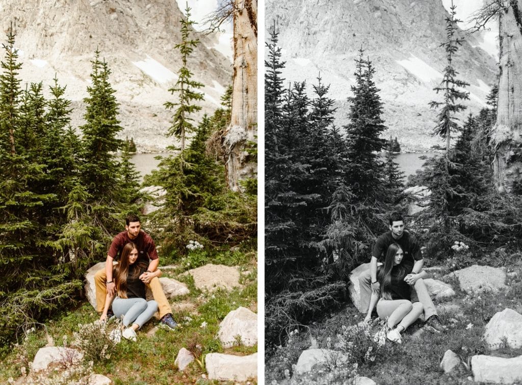 couple sitting together in the forest in Wyoming while having their engagement photos taken
