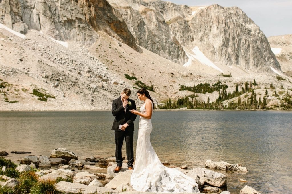 bride reading vows to groom during Wyoming wedding ceremony