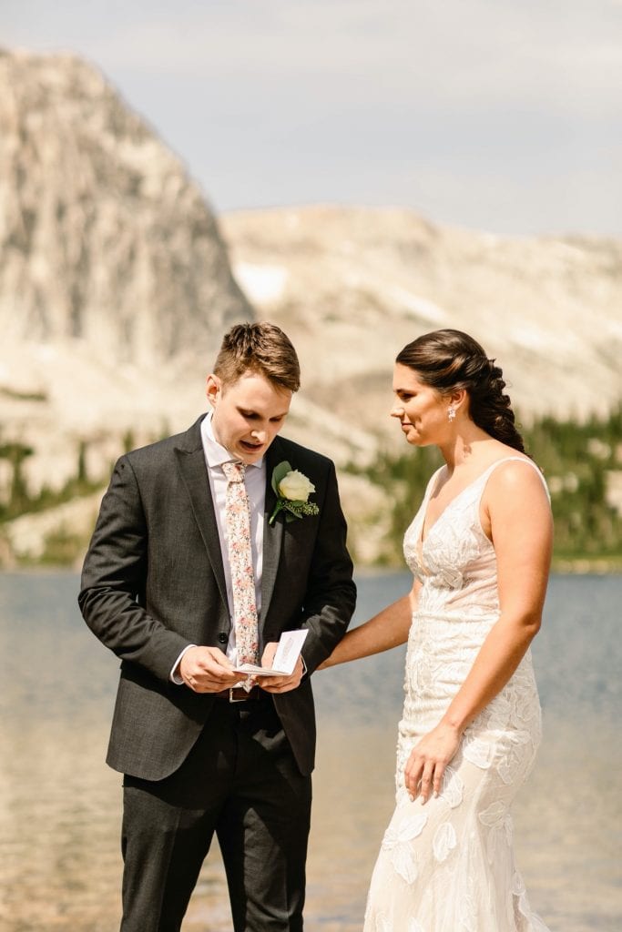 groom reading his vows to bride during Wyoming wedding ceremony